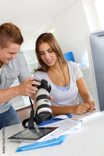 Photo: Student in photography working together on project Student in photography working together on project