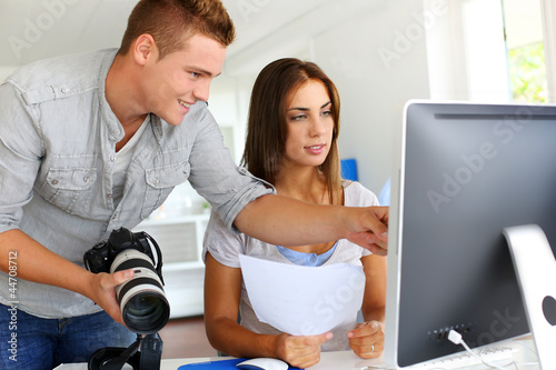 Photo: Student in photography working together on project Student in photography working together on project