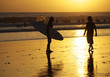 Surfers on a coastline