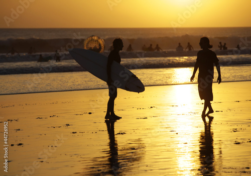 Photo: Surfers on a coastline Surfers on a coastline