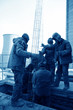 Photo: workers in the industrial enterprise construction workers in the industrial enterprise construction