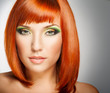 Beautiful Woman with Red Hair and bright makeup