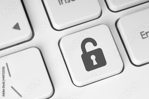 Photo: Open lock button on the keyboard, access concept Open lock button on the keyboard, access concept