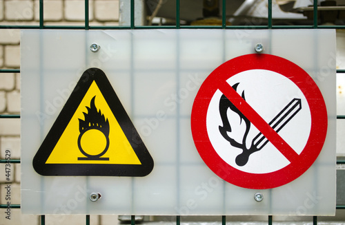 Photo: Fire warning signs compressed oxygen gas cylinders Fire warning signs compressed oxygen gas cylinders
