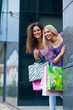 two woman friends shopping