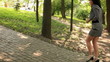 The young beautiful girl goes up in park