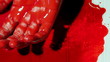 Bloody twitching hand with old film effect shot two