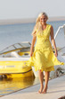 young happy woman on sea boats background