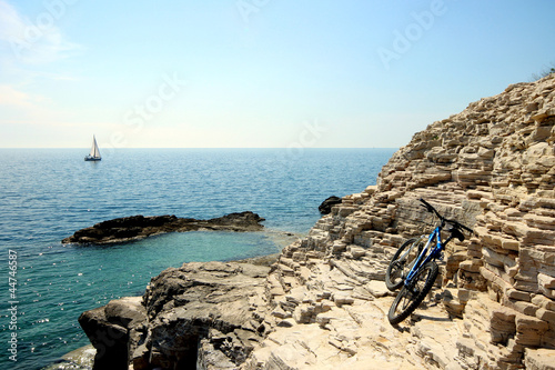 Photo: Bike, rocks and boat Bike, rocks and boat