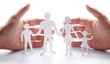 Cardboard figures of the family on a white background.