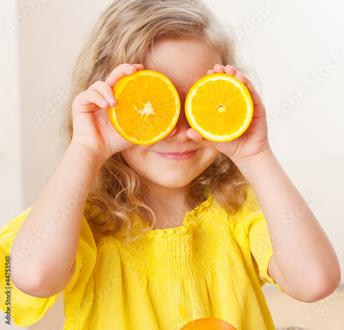 Photo: Child with orange Child with orange