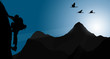 Silhouette of climbing young adult at the top of summit