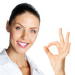Cheerful businesswoman with okay sign, over white