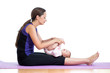 Mother doing yoga exercise with her baby