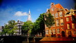 Streets, canals, bridges, buildings, boats in Amsterdam, Holland