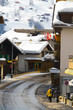 Snowboarders go along the street in Grindelwald.