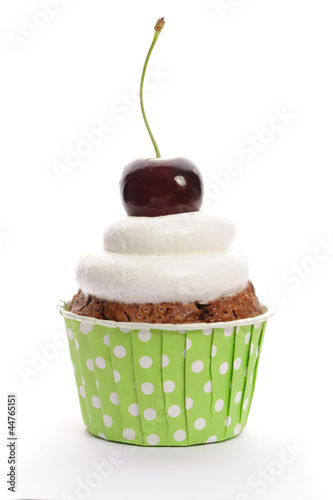 Photo: Cupcake with whipped cream and cherry Cupcake with whipped cream and cherry