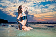 Beautiful brunette posing  on river bank.