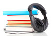 Headphones on books isolated on white