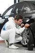 Photo: auto mechanic painting car element auto mechanic painting car element