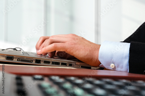 Photo: Worker using a laptop computer Worker using a laptop computer