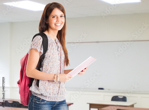 Photo: Portrait of a student in her classroom Portrait of a student in her classroom