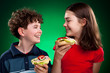 Kids eating big sandwiches