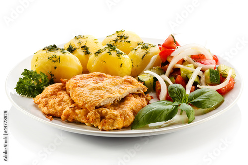 Photo: Pork chops, boiled potatoes and vegetable salad Pork chops, boiled potatoes and vegetable salad