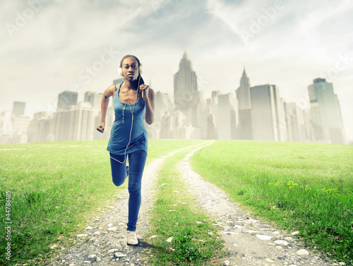 Photo: Black girl running in a grace field near New York Black girl running in a grace field near New York
