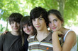 Four children stood together in park