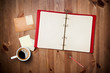 Workspace with coffee cup, instant photos, note paper and notebo