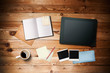 Workspace with coffee cup,  tablet pc, instant photos, note pape