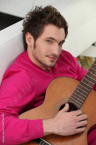 Photo: Young man playing the guitar Young man playing the guitar