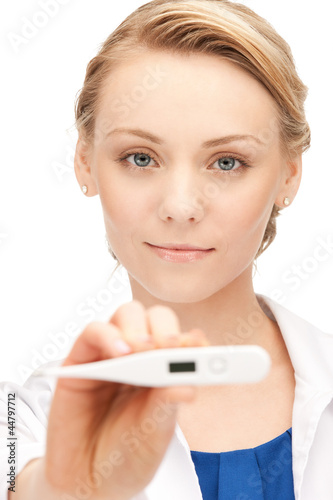 Photo: attractive female doctor with thermometer attractive female doctor with thermometer