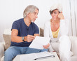 Senior couple discussing a document
