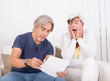 Senior couple discussing a document