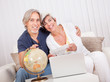 Ecstatic couple displaying holiday tickets