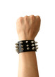 Fist of rocker in leather bracelet.