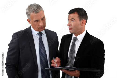 Photo: Assistant stood with boss Assistant stood with boss