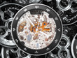 gears and mainspring in the mechanism of a pocket watch