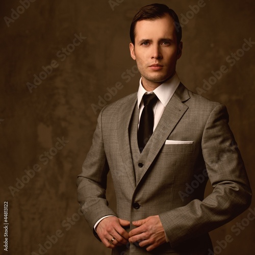 Photo: Handsome young man in classic suit Handsome young man in classic suit