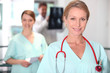 Photo: Female nurse in X-ray room. Female nurse in X-ray room.