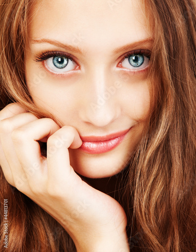 Photo: Portrait of a young woman with beautiful hair and blue eyes Portrait of a young woman with beautiful hair and blue eyes
