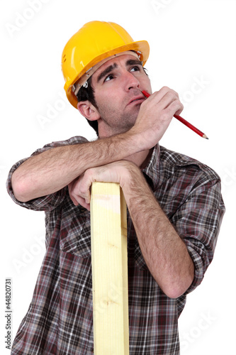 Photo: Thoughtful carpenter Thoughtful carpenter