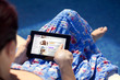 Young girl holding and touching a digital tablet
