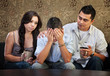 Photo: Sad Male Teenager with Parents Sad Male Teenager with Parents