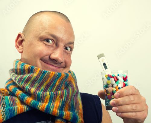 Photo: Man drinking pills Man drinking pills