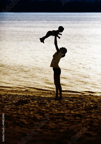 Photo: Mother and baby at beach Mother and baby at beach