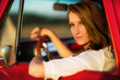 pretty young woman in an old pick-up