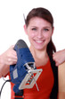 Female artisan holding jigsaw